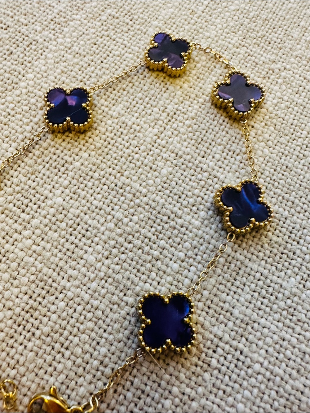 ONLY ONE Gold Bracelet with Dark Purple Clover Accents - Elegant Women's Jewelry